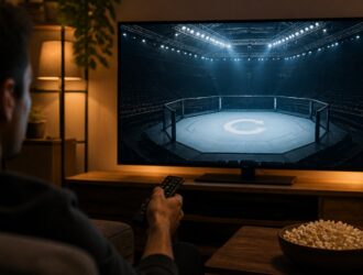 Viewer using a remote while watching a neutral arena replay scene.